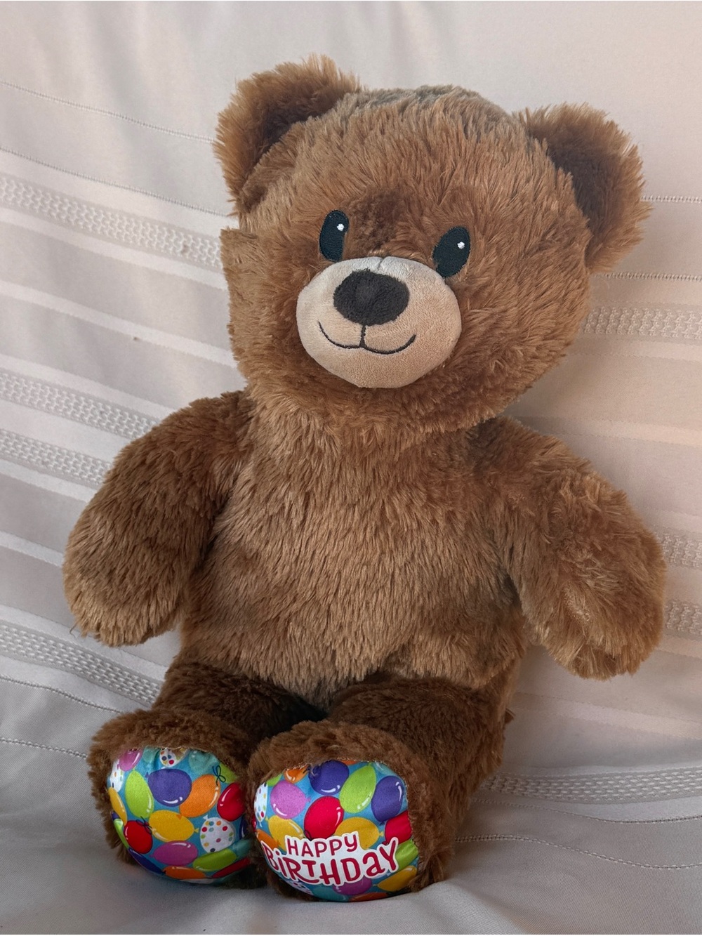 Light Brown Happy Birthday Build-A-Bear with multi-colored Balloon Feet
